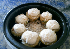 Mini Vanilla Cupcakes topped with Vanilla Coconut Cream garnished with Toasted Coconut